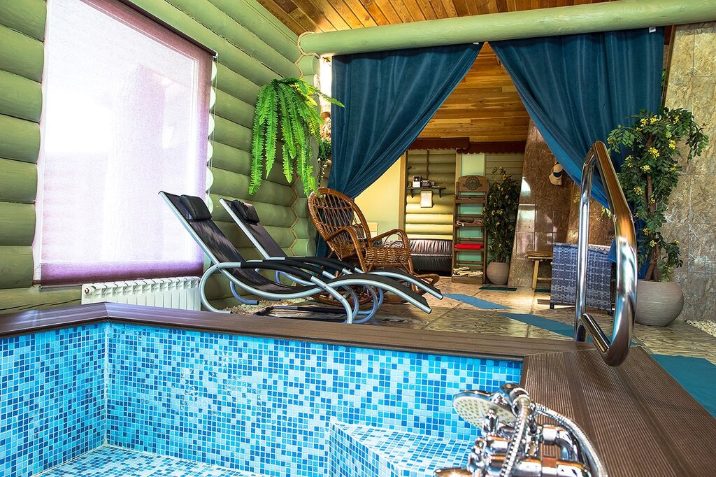 A log sauna with a pool