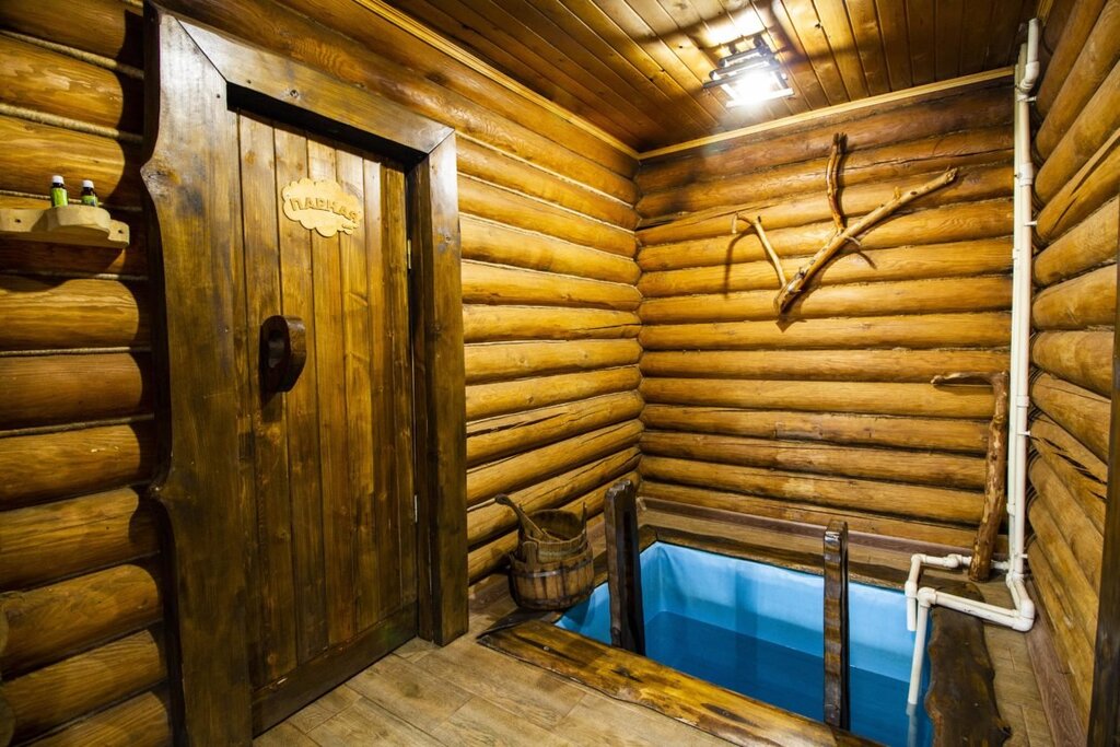 A sauna with a plunge pool inside