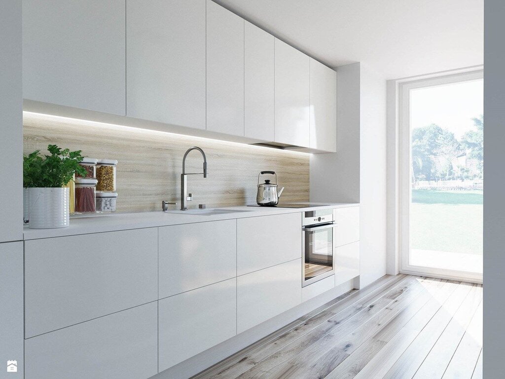 White glossy kitchen with a wooden countertop