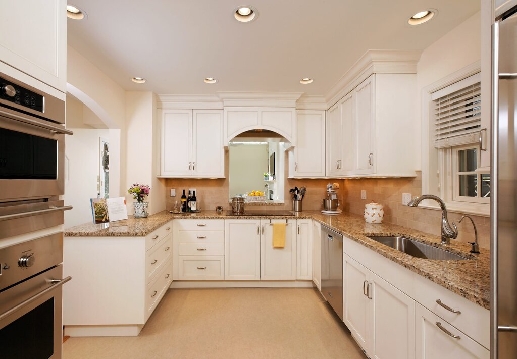 White kitchen with a beige backsplash