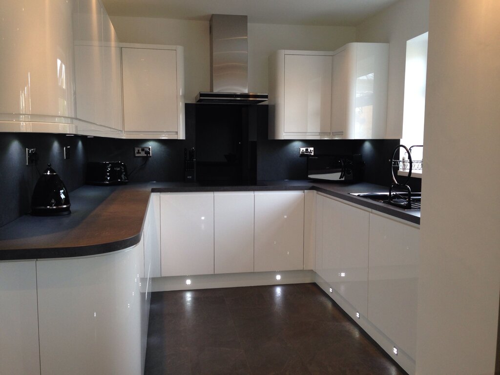 White kitchen with a black countertop