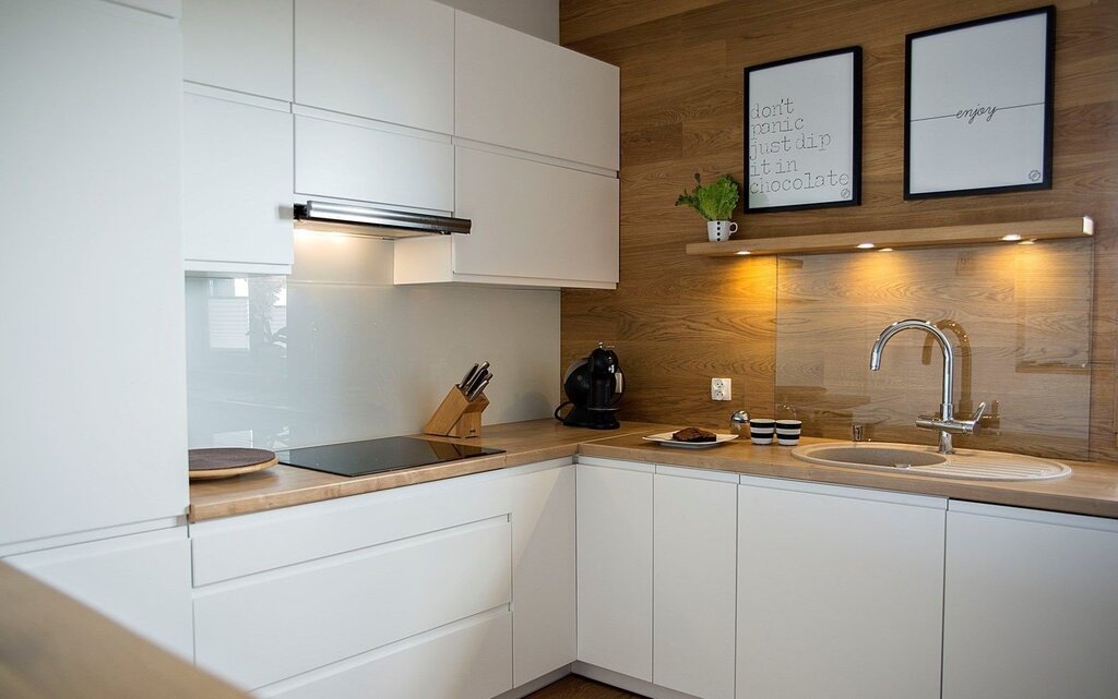 White kitchen with a wood-look backsplash