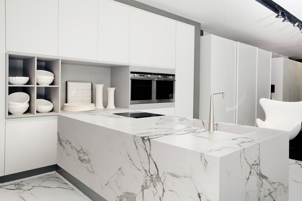 White kitchen with a marble backsplash