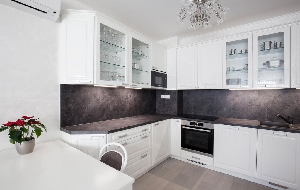 White kitchen with a dark brown countertop