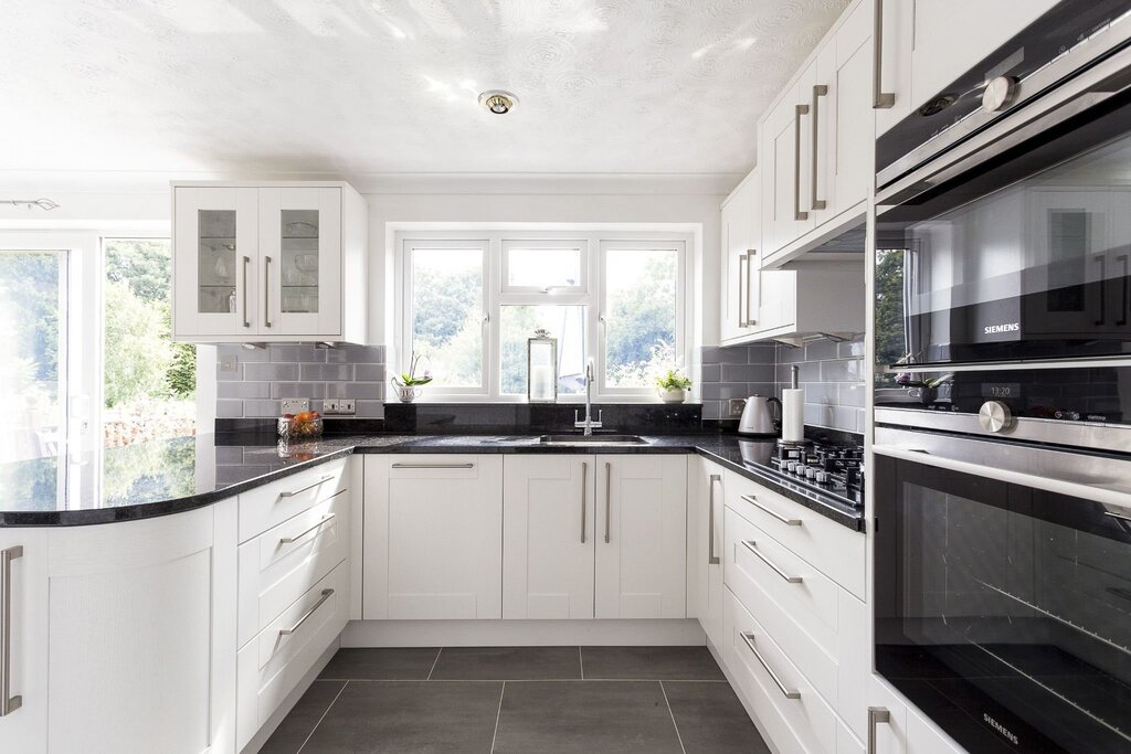 White kitchen with a dark countertop