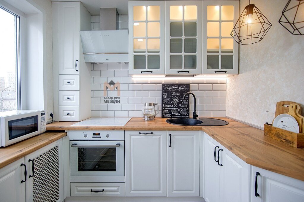 White corner kitchen with a wooden countertop