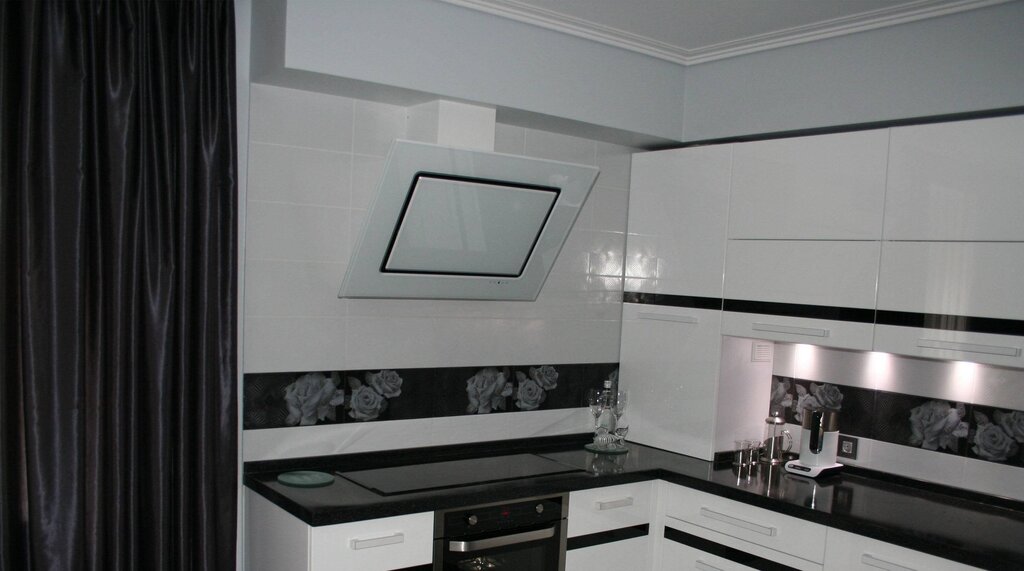 A white range hood in the kitchen