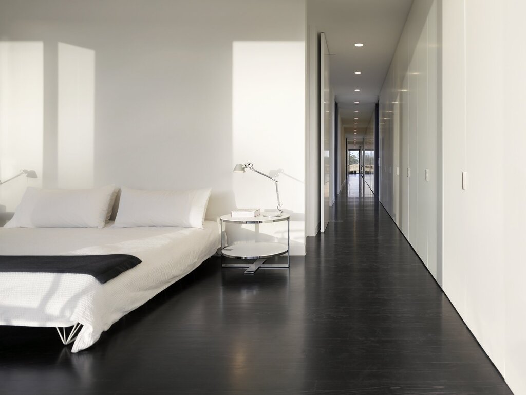 White walls, dark floor in the interior