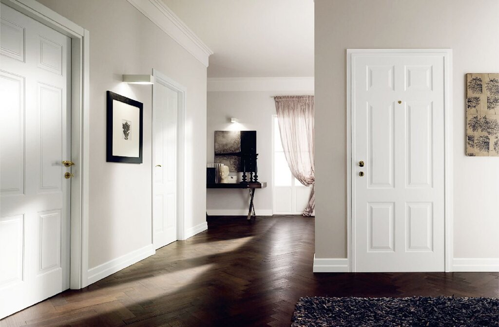 White baseboard and brown doors