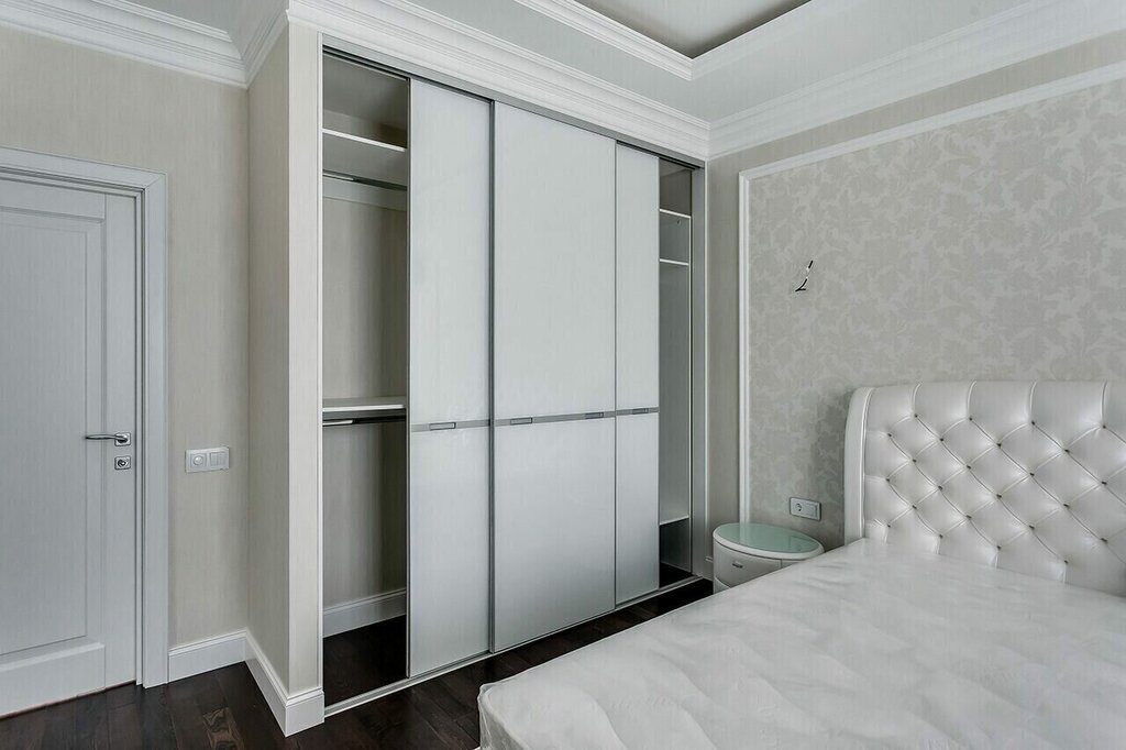 White sliding wardrobe for the bedroom