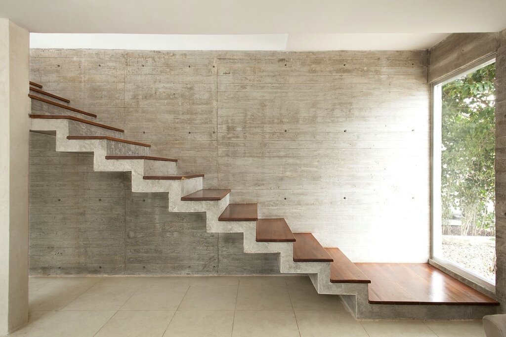 A concrete staircase clad with wood