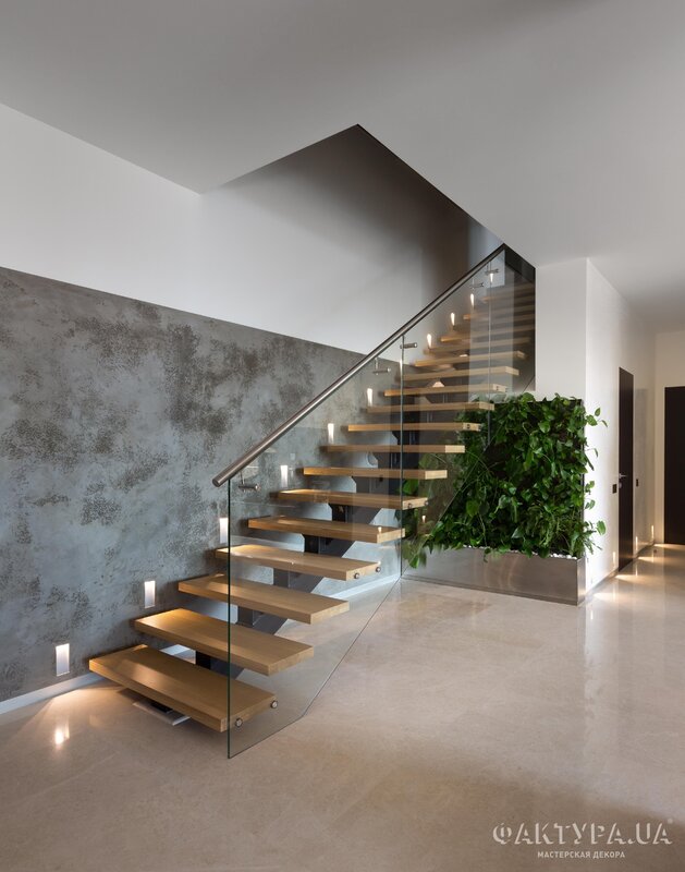 Concrete staircase with wooden steps