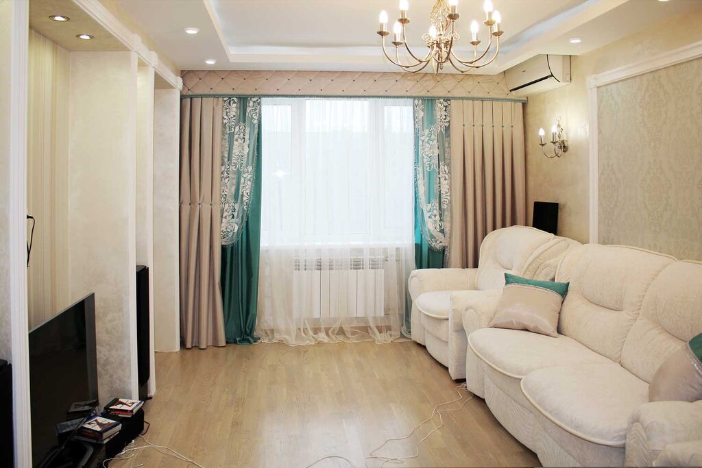 Beige curtains in the living room interior