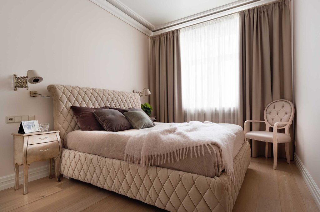 Beige curtains in the bedroom interior