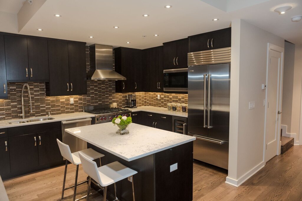 Beige and black kitchen in the interior