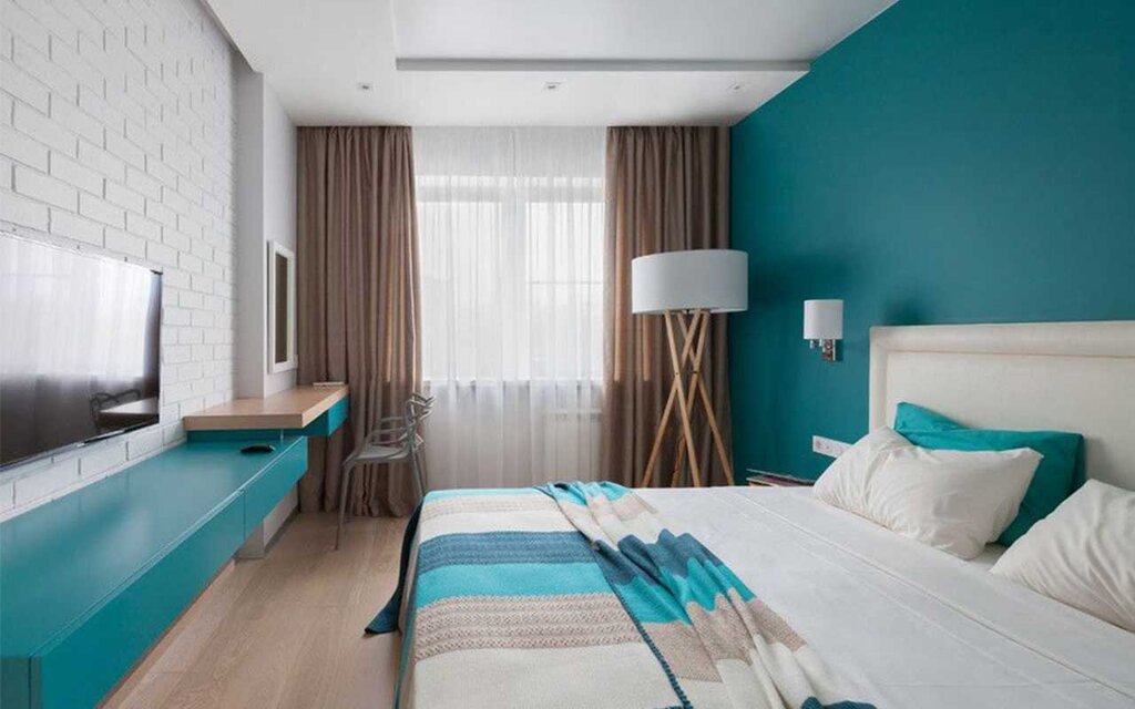 Turquoise wallpaper in the bedroom interior