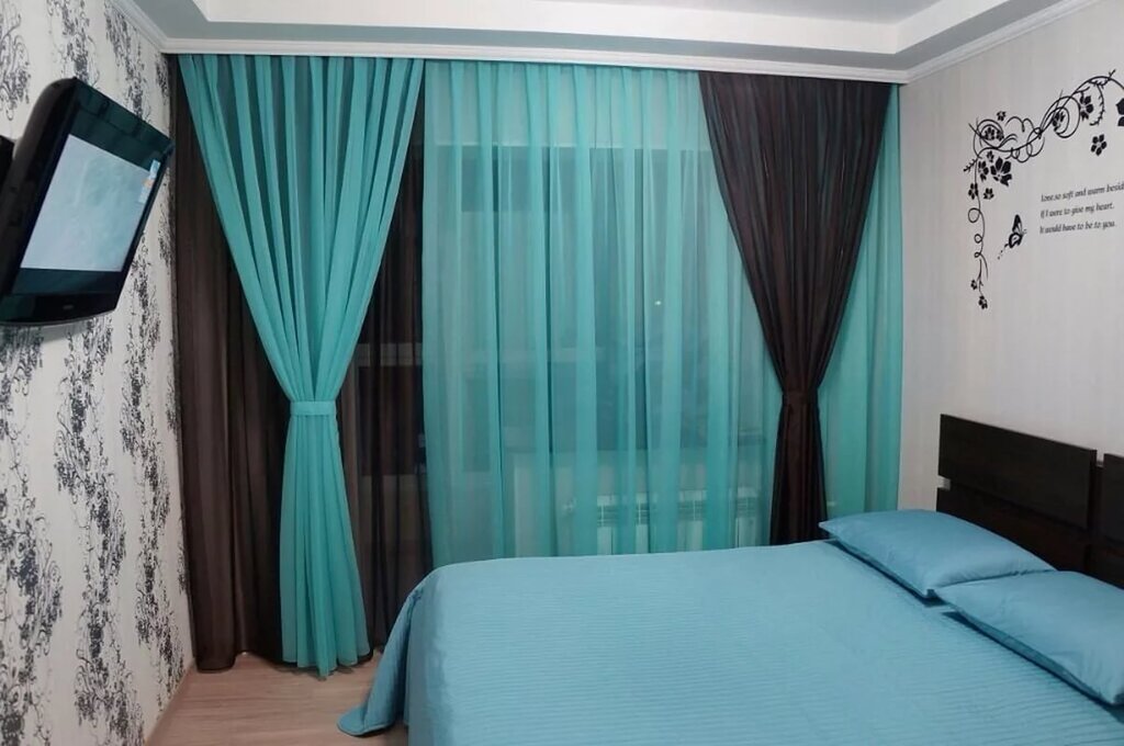 Turquoise curtains in the bedroom 29 фото