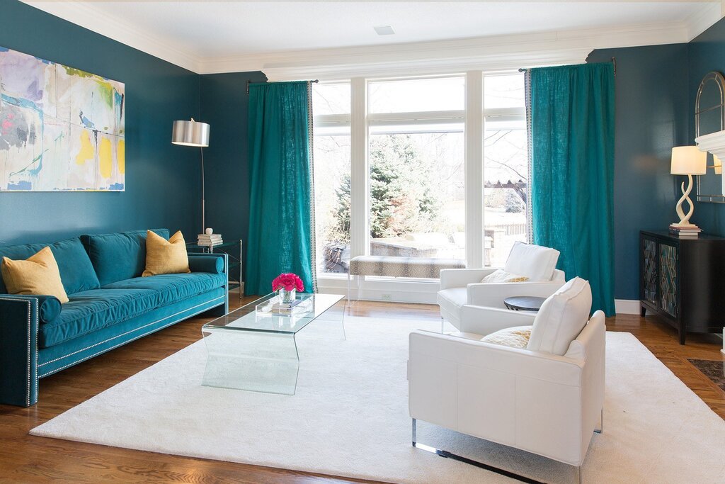 Turquoise sofa and curtains in the interior