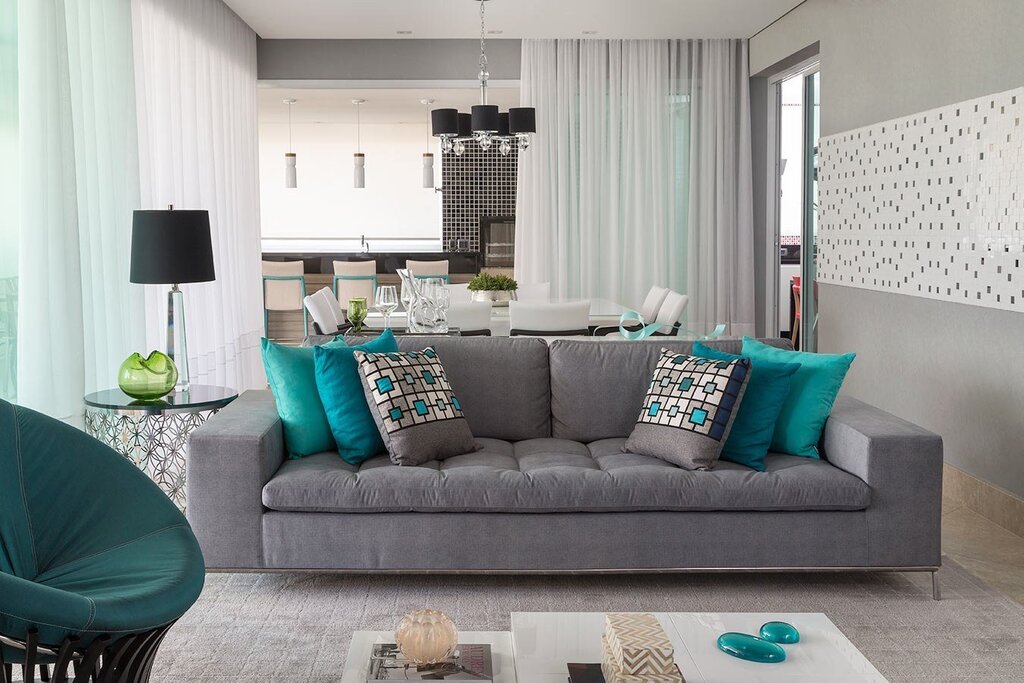 Turquoise sofa in a gray interior