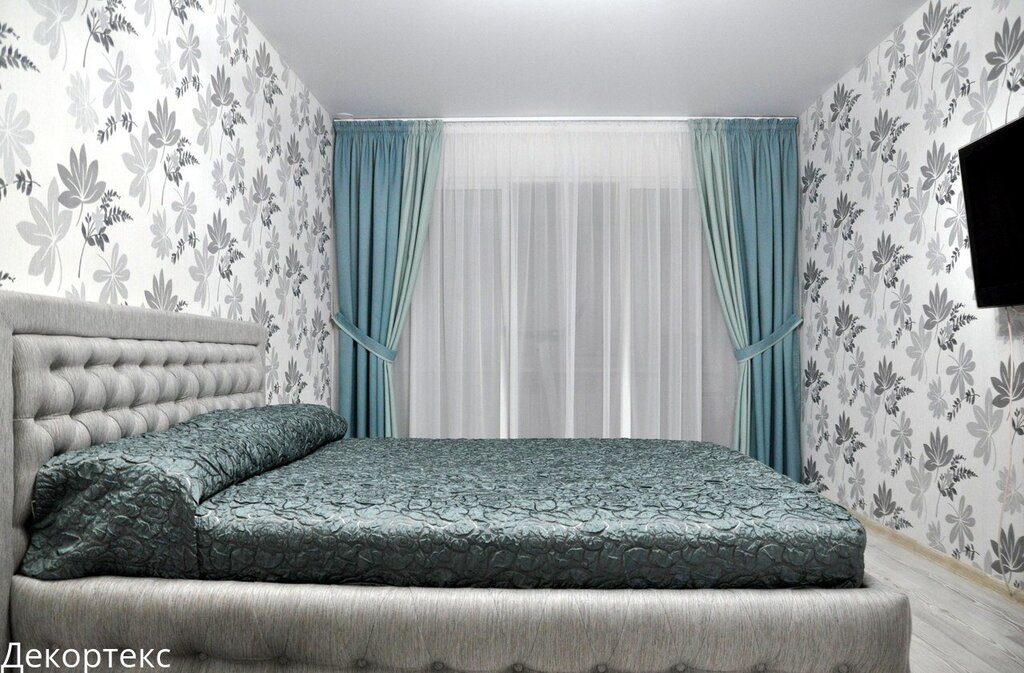 Turquoise bedspread for the bed in the bedroom