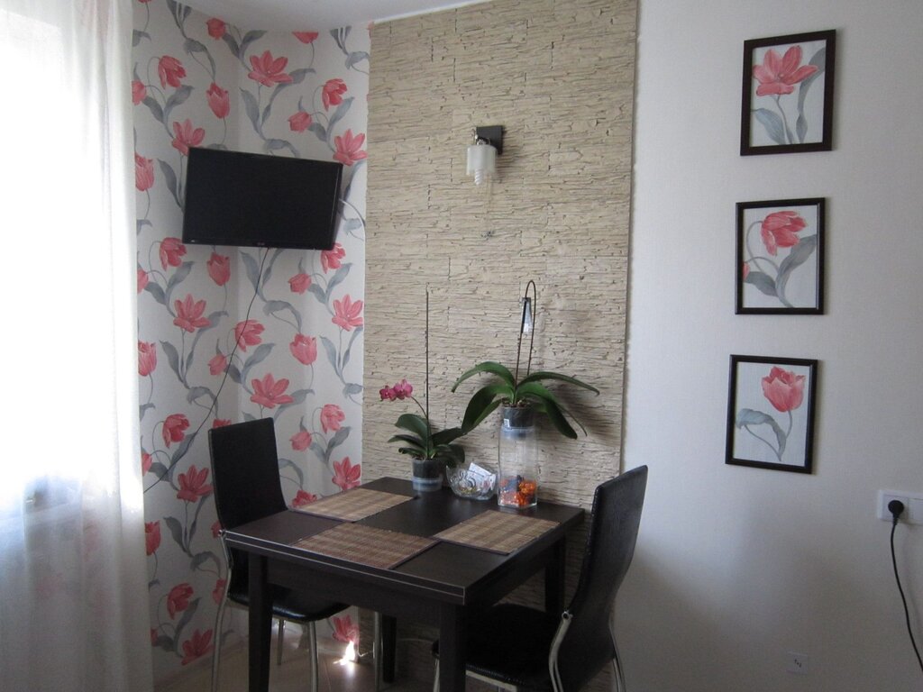 A wall lamp above the kitchen table