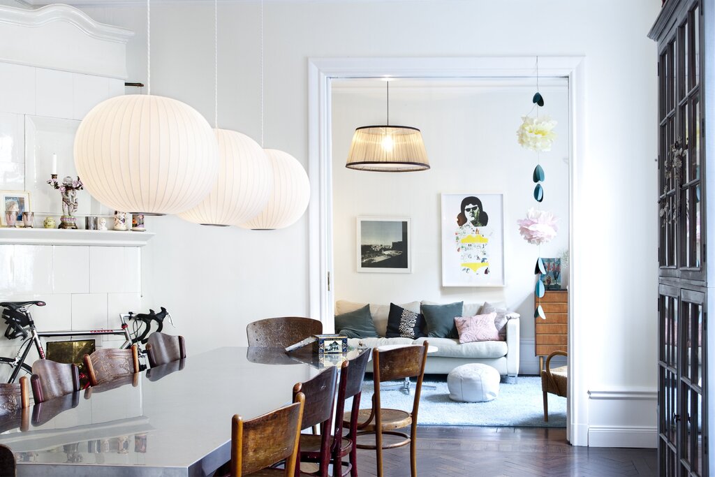 A wall lamp above the table in the kitchen