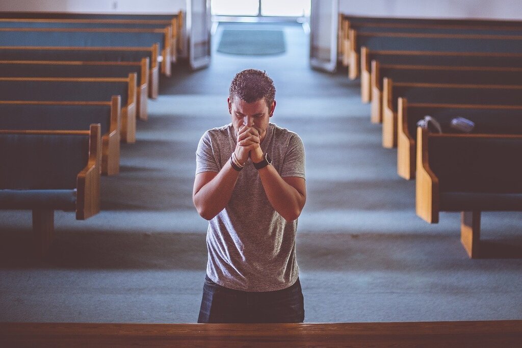 A person is praying to pictures