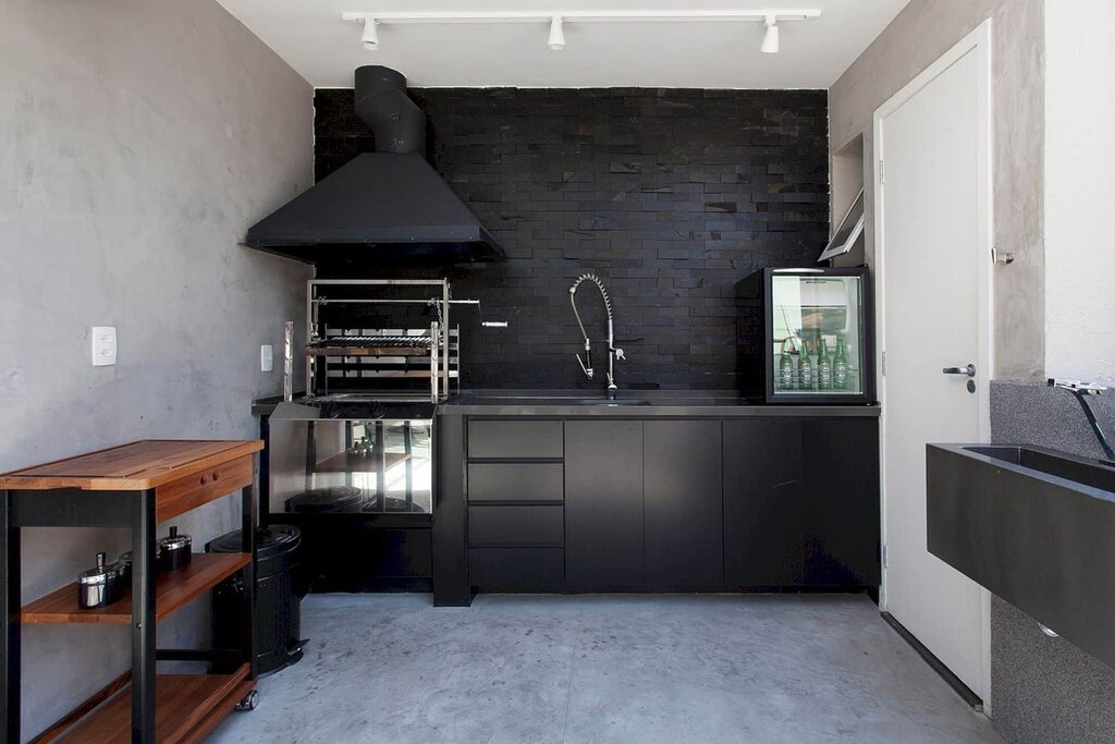 Black kitchen without upper cabinets