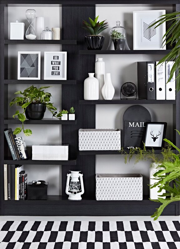 Black shelves on the wall