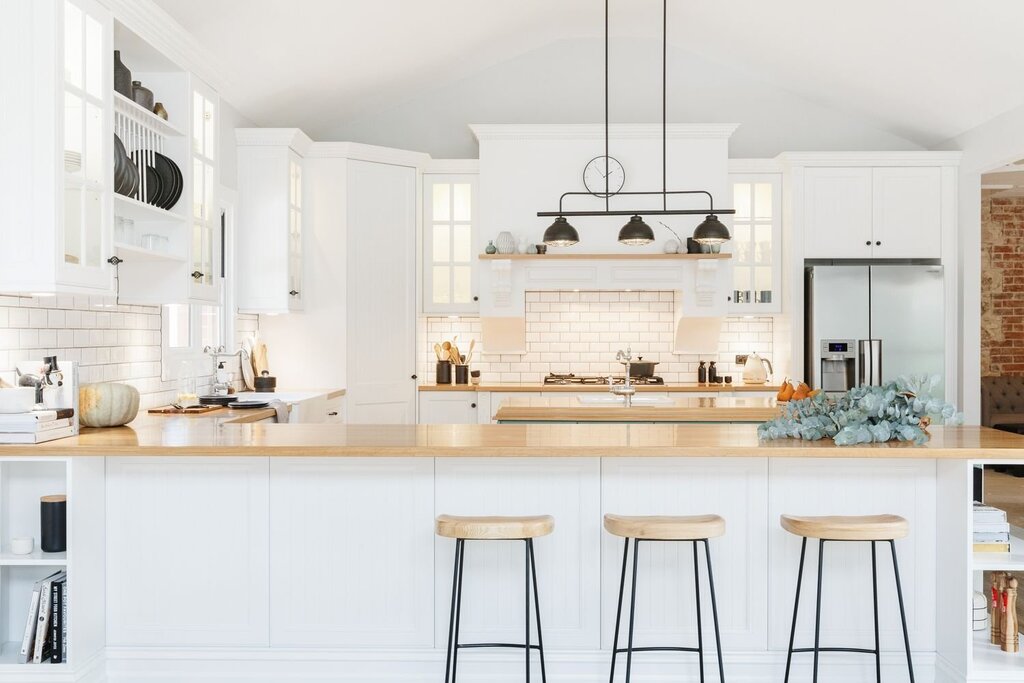 Black and white kitchen with a wooden countertop