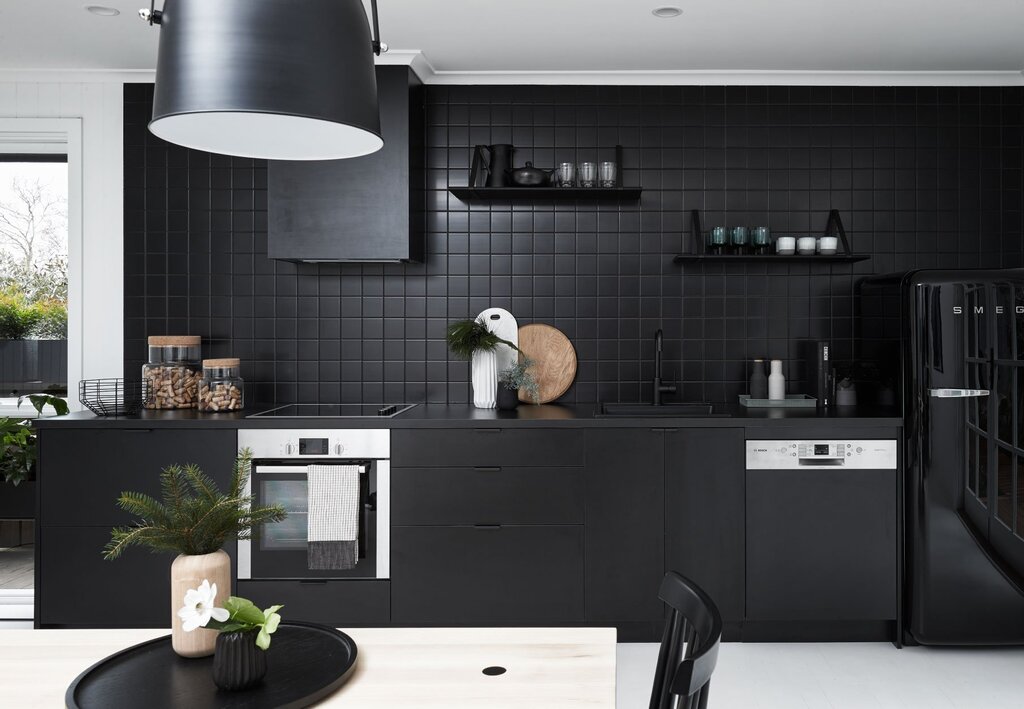 Black and gray kitchen in the interior