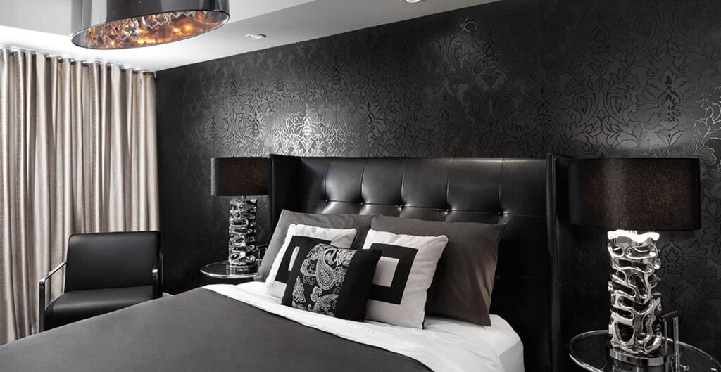 Black wallpaper in the bedroom interior