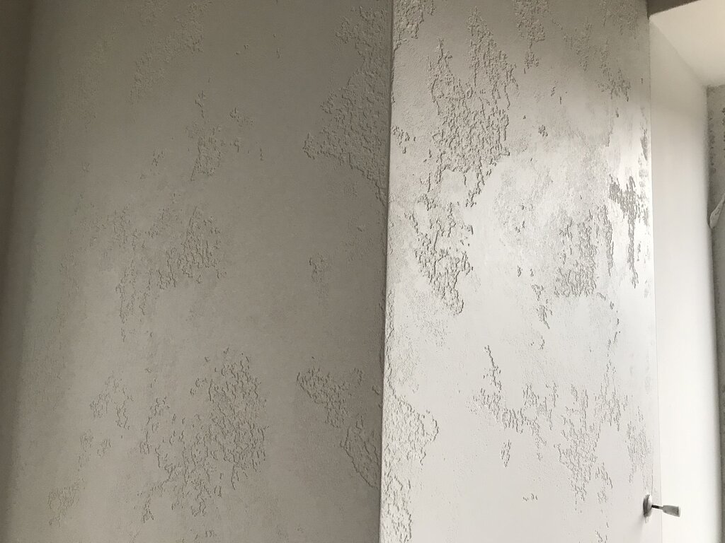 Decorative plaster world map in the hallway