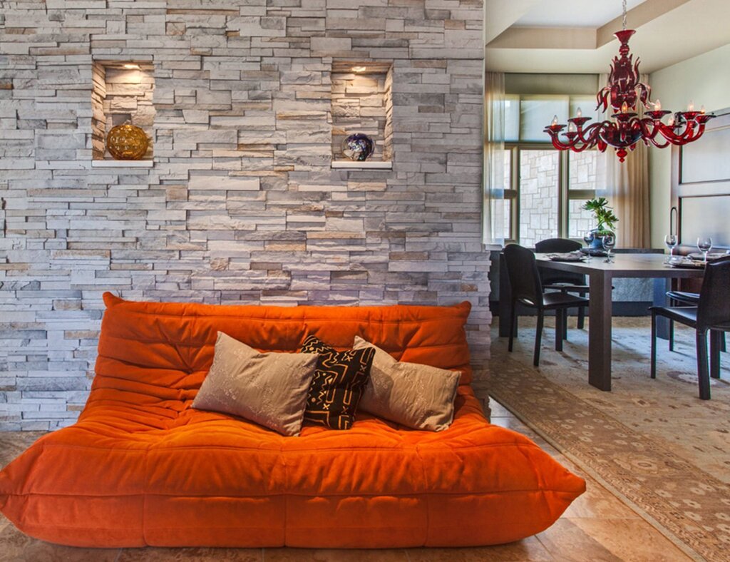 Decorative stones on the wall in the apartment