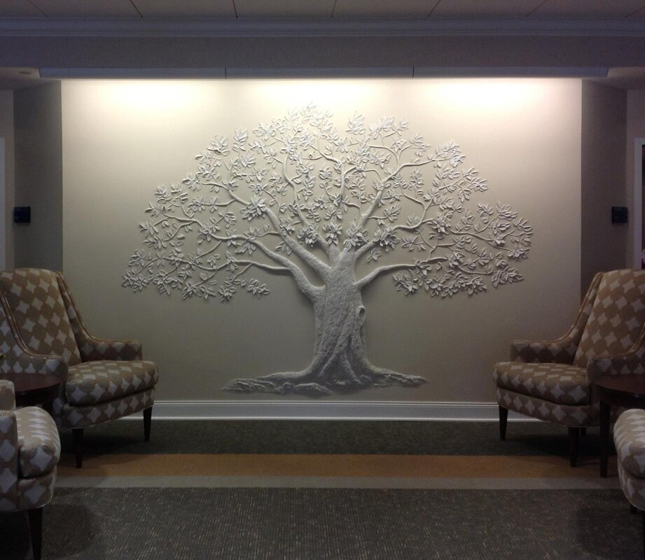 A tree made of plaster on the wall