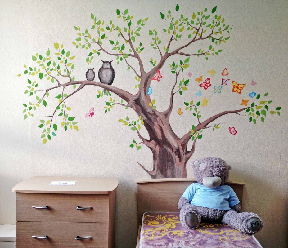 A tree on the wall in the children's room