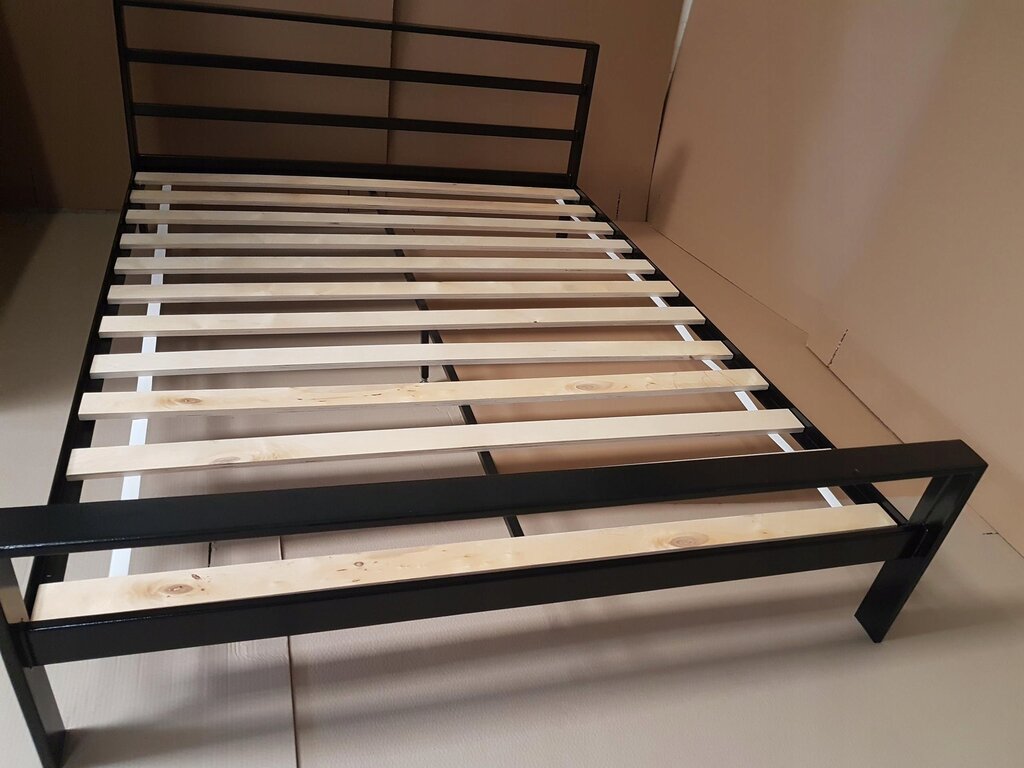 Wooden bed with a metal frame