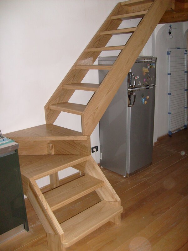 Wooden staircase to the attic