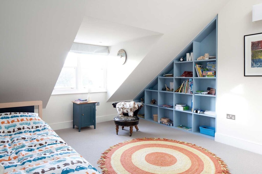 Children's room in the attic with a slanted ceiling