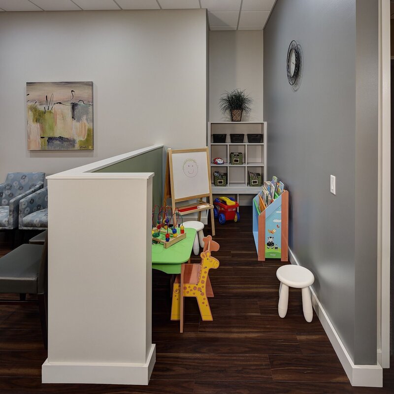 Children's corner in the room with parents