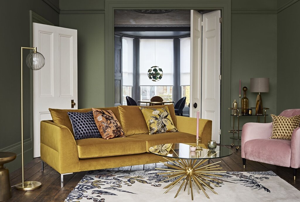 A mustard-colored sofa in the living room interior