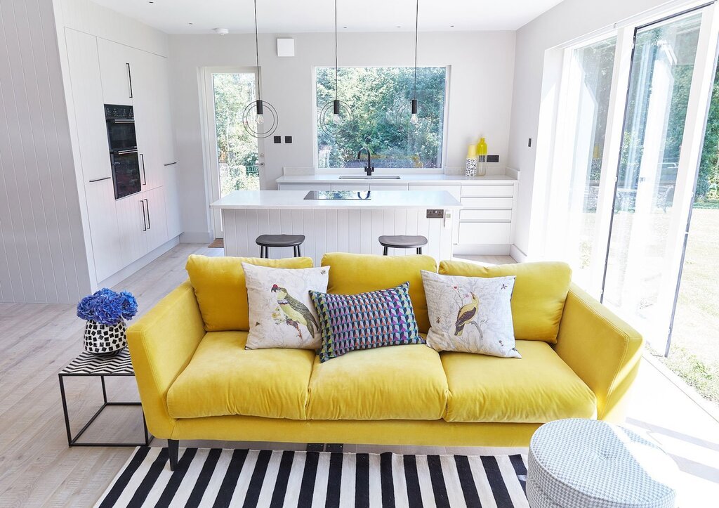 Room design with a yellow sofa