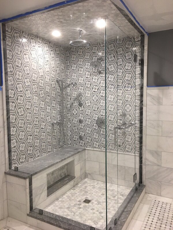 Shower cabin made of mosaic and tiles