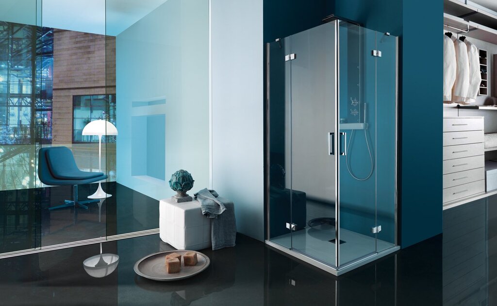 A glass shower enclosure without a tray