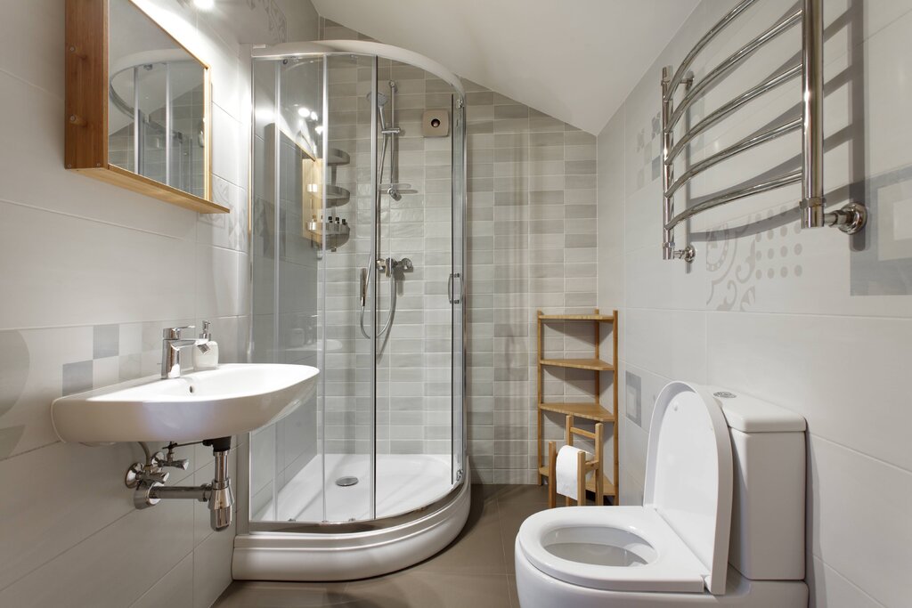 A shower cabin in a small bathroom