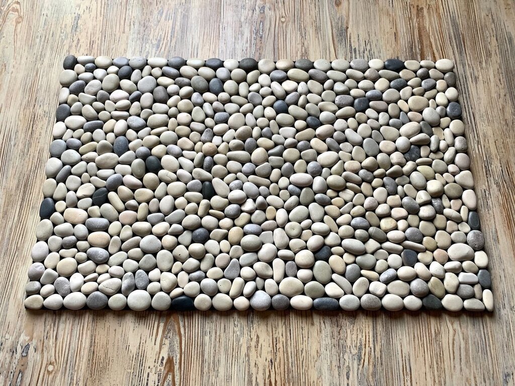 A shower tray made of pebbles