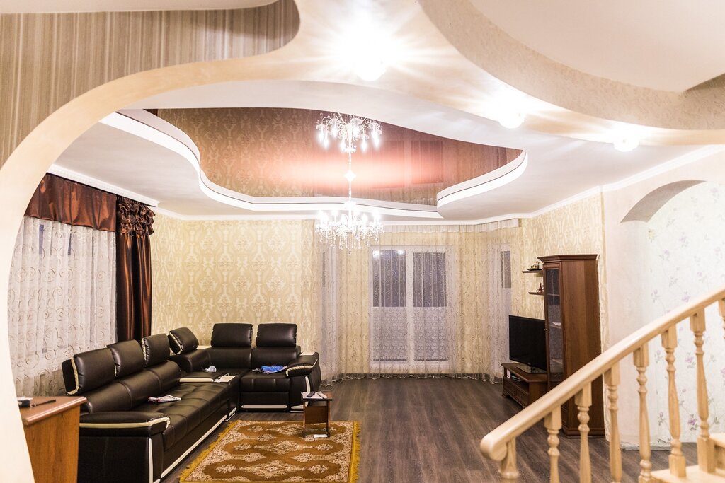 Two-tier stretch ceilings in the living room