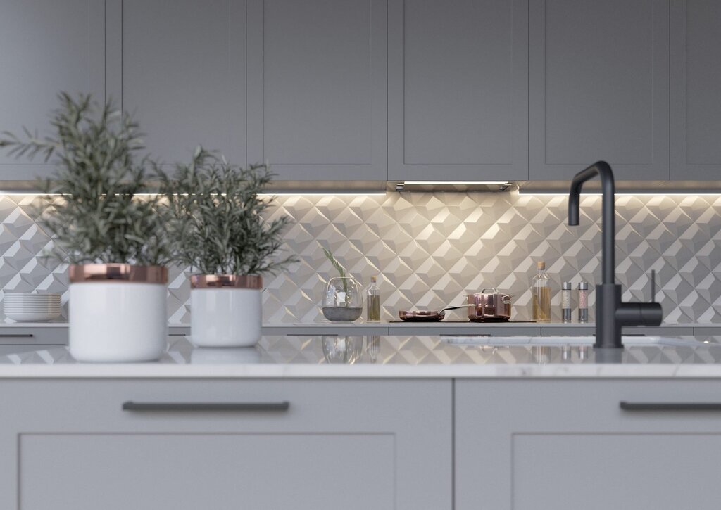 A kitchen backsplash made of large tiles