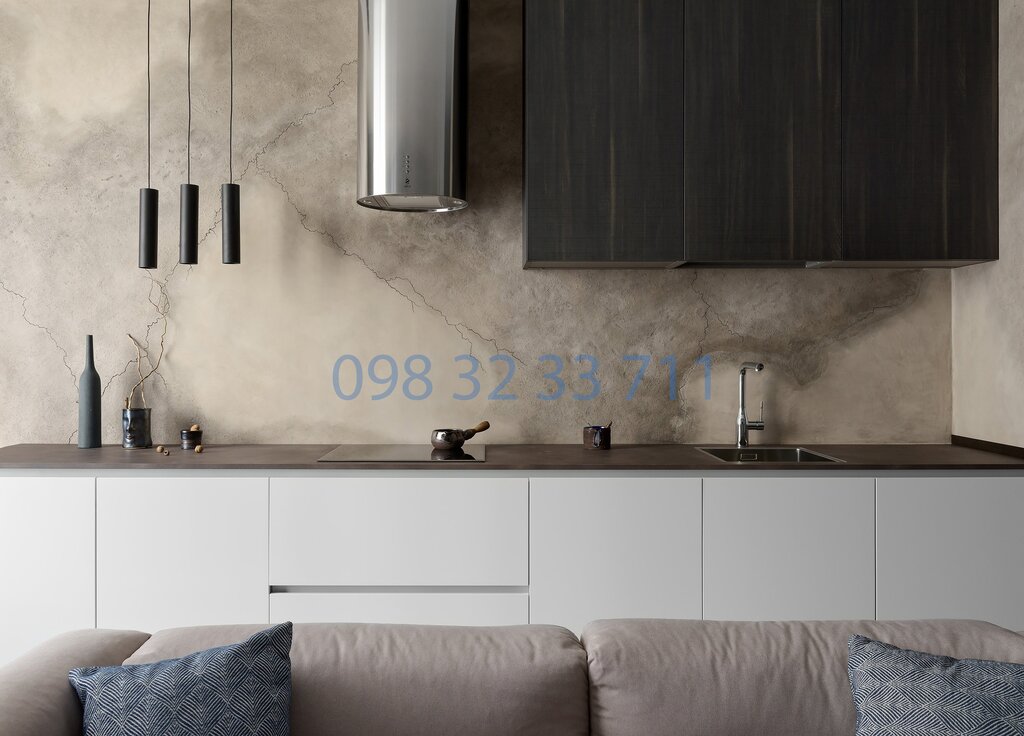 A decorative plaster backsplash in the kitchen