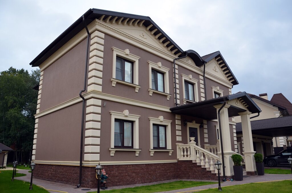 The facades of houses with decorative plaster